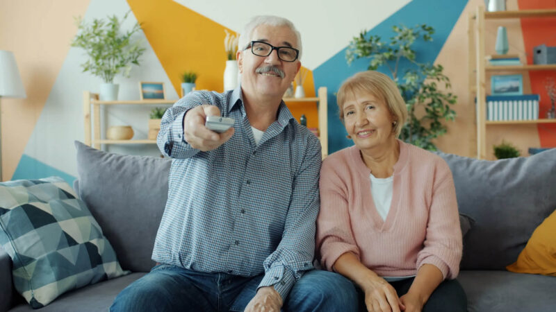 Man and Woman Watching TV in Living Room