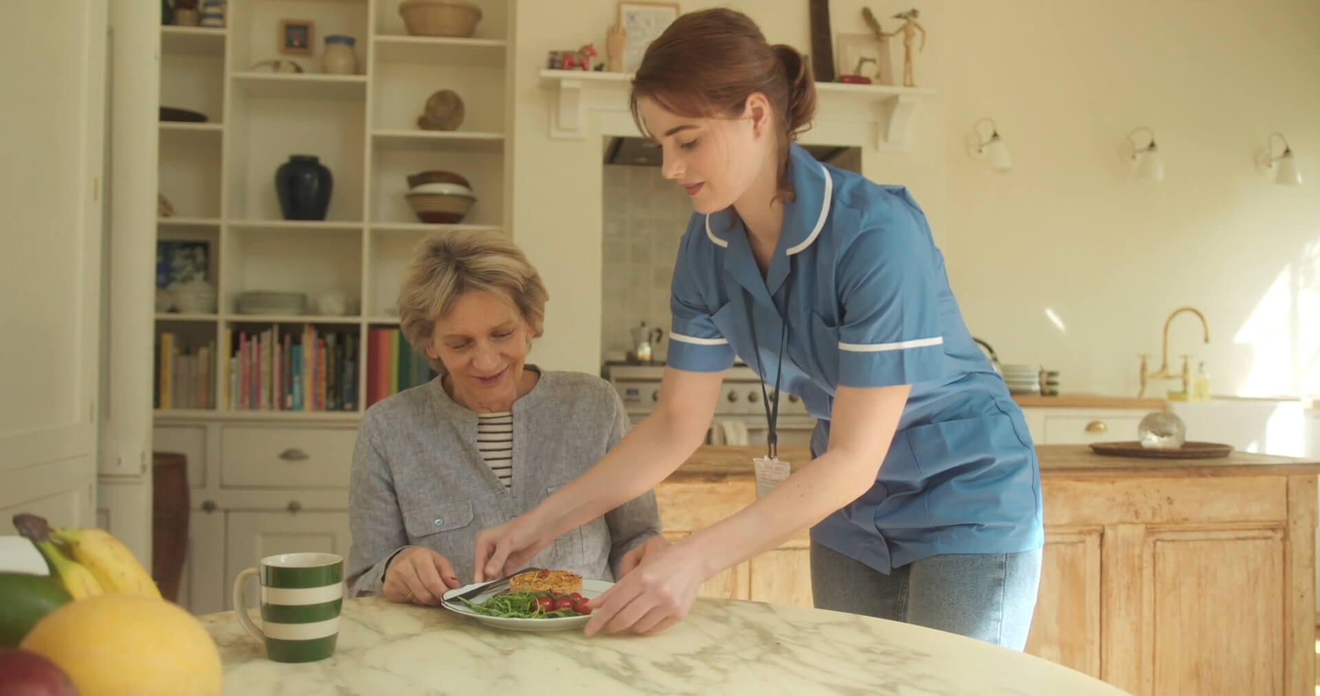 Nurse serving Dinner for Elderly Woman