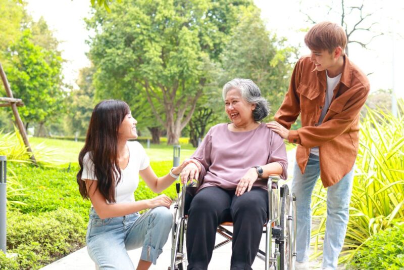 family members spending time with an older woman